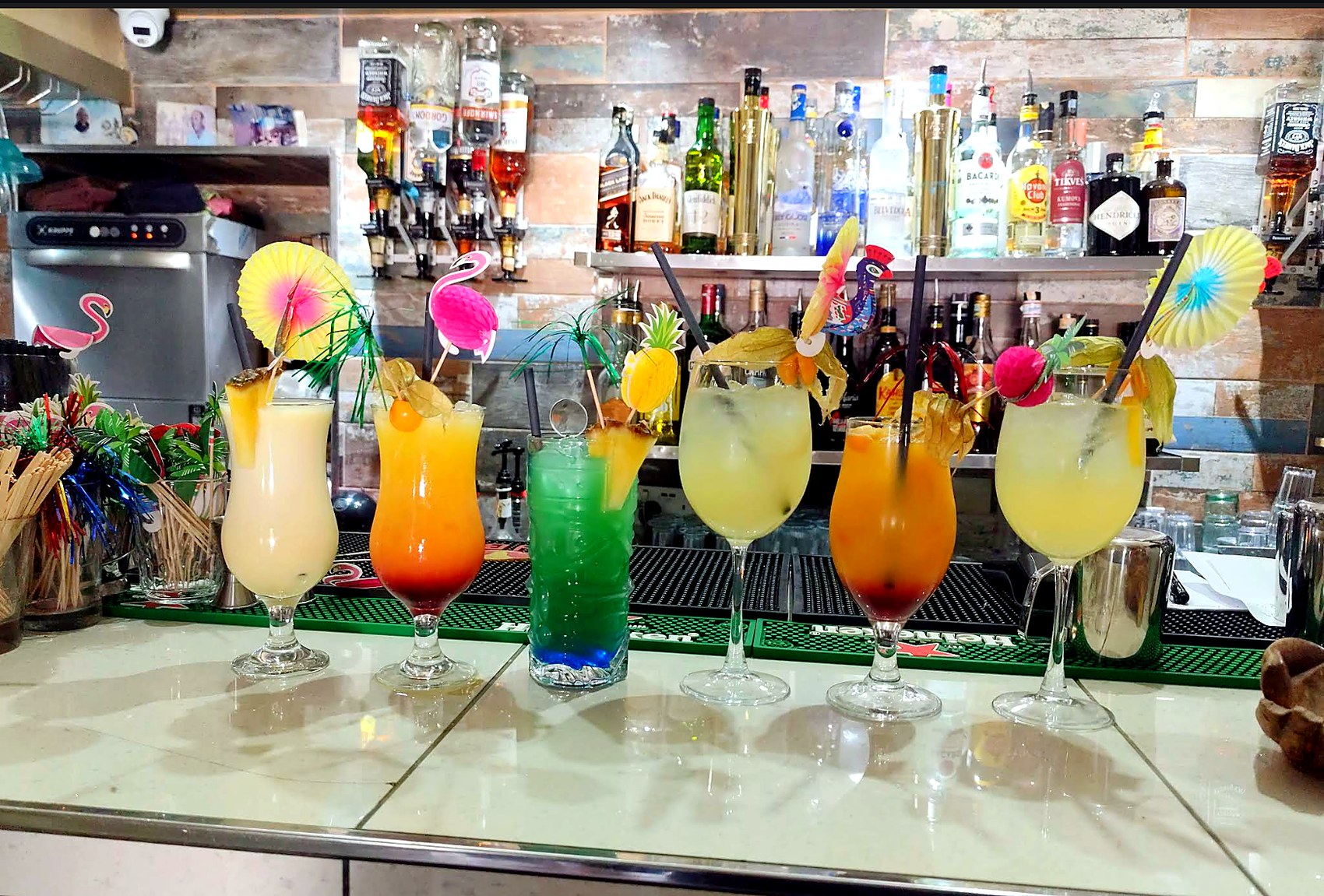 A row of colourful cocktails on the Il-Luzzu bar counter.